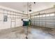Spacious garage with metal shelving, garage door, concrete flooring, and plenty of storage space at 2876 Bayshore Trails Dr, Tampa, FL 33611