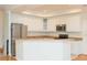 Bright kitchen with white cabinets, stainless steel appliances, and light countertops at 2876 Bayshore Trails Dr, Tampa, FL 33611