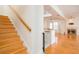 Stairway leading into the living room, showcasing the hardwood floors and fireplace at 2876 Bayshore Trails Dr, Tampa, FL 33611