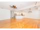 Spacious living room boasts hardwood floors, a fireplace, a ceiling fan and access to the kitchen at 2876 Bayshore Trails Dr, Tampa, FL 33611