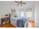 Comfortable bedroom with wood floors, natural light from two windows, creating a serene and inviting atmosphere at 3053 Pointeview Dr, Tampa, FL 33611