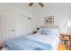 Bright bedroom with wood floors, soft lighting, offering a peaceful retreat for rest and relaxation at 3053 Pointeview Dr, Tampa, FL 33611
