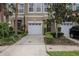 Inviting townhome with manicured landscaping, a one-car garage and neutral paint tones at 3053 Pointeview Dr, Tampa, FL 33611