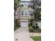 Townhome with manicured landscaping, a one-car garage, and neutral paint tones at 3053 Pointeview Dr, Tampa, FL 33611