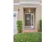 Inviting front door with decorative wreath and sidelight window feature at 3053 Pointeview Dr, Tampa, FL 33611