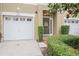 Charming front exterior view of the townhome with attached garage at 3053 Pointeview Dr, Tampa, FL 33611