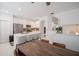Spacious kitchen with a large island, stainless steel appliances, and an adjacent dining area with wood table and leather chairs at 3053 Pointeview Dr, Tampa, FL 33611