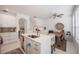 Modern kitchen featuring a large island, stainless steel appliances, and an adjacent dining area, perfect for Gathering meals at 3053 Pointeview Dr, Tampa, FL 33611