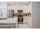 Well-equipped kitchen featuring modern stainless steel appliances, white cabinetry, and stylish backsplash, making cooking a pleasure at 3053 Pointeview Dr, Tampa, FL 33611