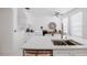 Bright kitchen featuring a large island, stainless steel sink, and an adjacent dining area perfect for entertaining and everyday living at 3053 Pointeview Dr, Tampa, FL 33611
