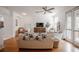 Bright living room with wood floors, modern furniture, and large windows that provide lots of natural light at 3053 Pointeview Dr, Tampa, FL 33611