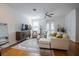 Open living room with hardwood floors, a ceiling fan and stylish décor at 3053 Pointeview Dr, Tampa, FL 33611