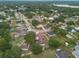 Aerial view of a residential area, highlighting the property's proximity to a nearby lake at 3509 King George Ln, Seffner, FL 33584