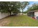 Spacious backyard featuring a pool, boat storage, and a well-maintained lawn at 3509 King George Ln, Seffner, FL 33584