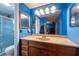 Bathroom featuring a vanity sink, toilet, shower, and a large mirror at 3509 King George Ln, Seffner, FL 33584