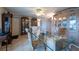 Dining room with a glass table, ceiling fan, and neutral colors at 3509 King George Ln, Seffner, FL 33584