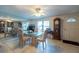 Lovely dining room with a glass table, ceiling fan, and a neutral color palette at 3509 King George Ln, Seffner, FL 33584