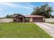 Charming single-Gathering home with a well-manicured lawn and a freshly sealed driveway at 3509 King George Ln, Seffner, FL 33584