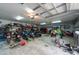 Spacious garage interior filled with motorcycles, tools, and storage, providing ample space for hobbies and projects at 3509 King George Ln, Seffner, FL 33584