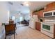 Open-plan kitchen flowing into the living room at 3509 King George Ln, Seffner, FL 33584