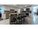 Updated kitchen with granite countertops, stainless steel appliances, and breakfast bar seating at 3509 King George Ln, Seffner, FL 33584
