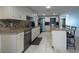 Well-equipped kitchen with stainless appliances, granite counters, and a convenient breakfast bar at 3509 King George Ln, Seffner, FL 33584