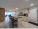 Open kitchen with a breakfast bar and views to living room at 3509 King George Ln, Seffner, FL 33584