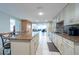 Spacious kitchen featuring an island, granite countertops, and ample cabinet space at 3509 King George Ln, Seffner, FL 33584