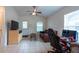 Comfortable living room featuring tile flooring and a ceiling fan at 3509 King George Ln, Seffner, FL 33584
