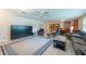 Spacious living area with comfortable seating, a large screen TV, and lots of natural light at 3509 King George Ln, Seffner, FL 33584