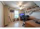 Office space with shelves, desk, closet, fan, and a TV at 3509 King George Ln, Seffner, FL 33584