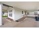 Covered carport with access ramp, mature landscape, and vinyl siding for easy maintenance at 36701 Jodi Ave, Zephyrhills, FL 33542