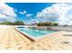 Community pool with shade and plenty of seating for residents at 36701 Jodi Ave, Zephyrhills, FL 33542