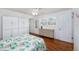 Bedroom with wood floors, neutral walls, ample natural light and ceiling fan at 4154 56Th N St # 720, Kenneth City, FL 33709