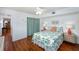 Bright bedroom featuring white walls, wood flooring and tropical print bedspread at 4154 56Th N St # 720, Kenneth City, FL 33709