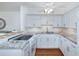 Modern kitchen featuring granite counters, white cabinets, stainless steel appliances, and wood floors at 4154 56Th N St # 720, Kenneth City, FL 33709