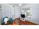 Cozy living room featuring hardwood flooring, a ceiling fan, and outdoor access at 4154 56Th N St # 720, Kenneth City, FL 33709