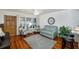 Inviting living room with wood floors, comfortable seating, and a window offering natural light at 4154 56Th N St # 720, Kenneth City, FL 33709