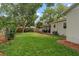 Lush green backyard featuring a covered patio and well-maintained landscaping at 4309 W Empedrado St, Tampa, FL 33629