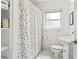 Bright bathroom with a polka dot shower curtain and stylish fixtures at 4309 W Empedrado St, Tampa, FL 33629