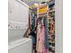 Organized walk-in closet with built-in shelving, hanging rods, and a washer/dryer combo at 4309 W Empedrado St, Tampa, FL 33629