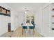 Bright dining room showcasing tile floors, built-in cabinets, and natural light from the glass doors at 4309 W Empedrado St, Tampa, FL 33629