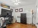 Functional office with a desk, computer, shelving, and hardwood floors at 4309 W Empedrado St, Tampa, FL 33629