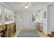 Bright sun room features an antique cabinet, tile floors, and lots of natural light at 4309 W Empedrado St, Tampa, FL 33629
