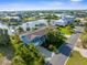 Aerial view of property highlighting its lush landscaping, waterfront location, and neighborhood at 4523 Gulfstream Dr, Hernando Beach, FL 34607