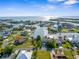 An aerial view reveals the home's prime location in a picturesque waterfront community with stunning water views at 4523 Gulfstream Dr, Hernando Beach, FL 34607