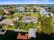 Spacious waterfront home featuring a private dock, covered boat lift, and inviting outdoor living spaces with a pool at 4523 Gulfstream Dr, Hernando Beach, FL 34607