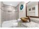 A modern bathroom features a unique glass bowl sink, granite countertop, and tiled shower at 4523 Gulfstream Dr, Hernando Beach, FL 34607