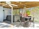 Outdoor entertainment area with hot tub, bar seating, and lattice details, perfect for relaxation at 4523 Gulfstream Dr, Hernando Beach, FL 34607