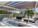 Inviting outdoor deck with comfortable seating, a glass table, and picturesque water views at 4523 Gulfstream Dr, Hernando Beach, FL 34607